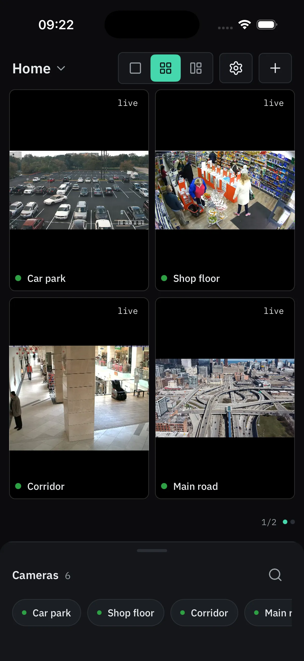 The ViewTile wall on an iPhone in the 2×2 layout: a car park, a shop floor, a corridor and a main road, each with a green dot and its name.